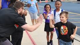 Rain doesn’t dampen spirits of DeKalb students, parents heading into first day of school
