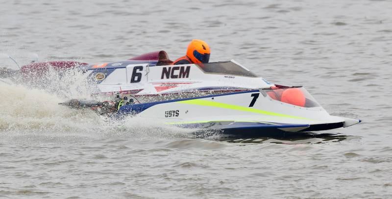 Kevin Ellison of Luxemburg Wis., races along side of Pete Nydahl of Bristol Wis., during the US Title Series Pro National Championship Boat Races on Saturday, July 27, 2024 at Lake DePue.