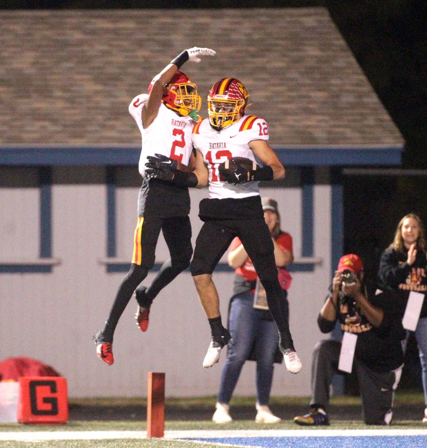 Batavia’s Isaiah Brown (left) and Luke Alwin celebrate Alwin’s touchdown during a game at Geneva on Friday, Sept. 29, 2023.