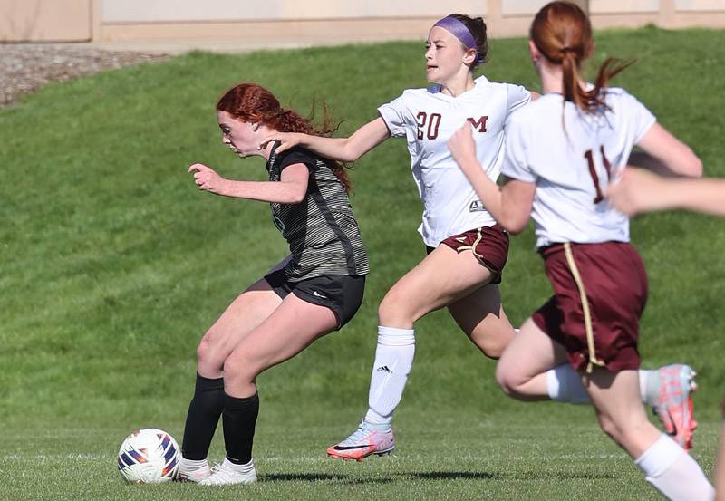 Sycamore's Izzie Segreti gets off a shot in front of Morris' Nicolette Boelman during their Interstate 8 Conference Tournament semifinal game Wednesday, May 3, 2023, at Sycamore High School.