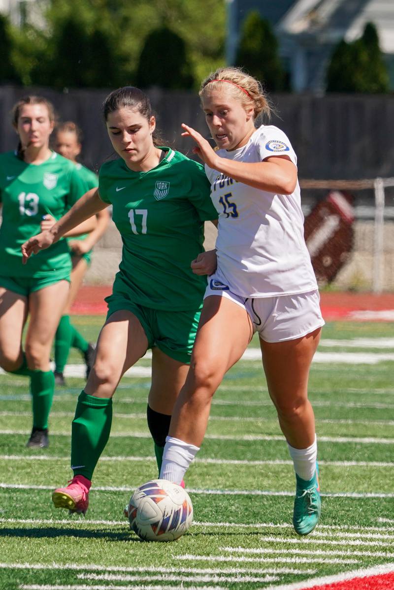 York’s Tatum Mailander (17) challenges Lyons’ Zibby Mchaelson (15) for the ball during a Class 3A Hinsdale Central Sectional girls soccer championship match at Hinsdale Central High School on Saturday, May 25, 2024.
