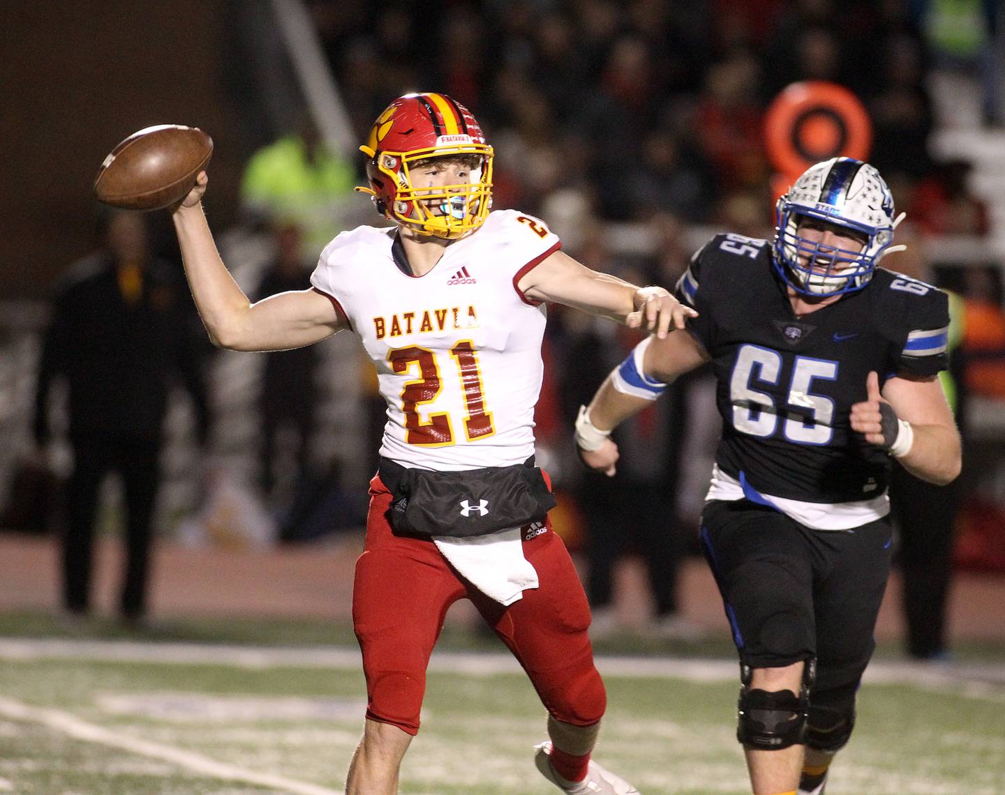 Batavia quarterback Ryan Boy throws the ball during a game at St. Charles North on Friday, Oct. 22, 2021.