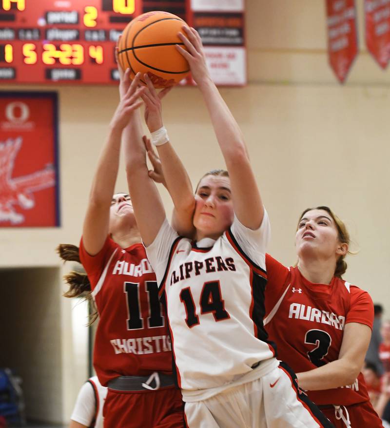 Amboy's Jillian Anderson (14) rebounds against Aurora Christian at the Oregon Girls Tip-Off Tournament on Wednesday, Nov. 19, 2025 in Oregon.