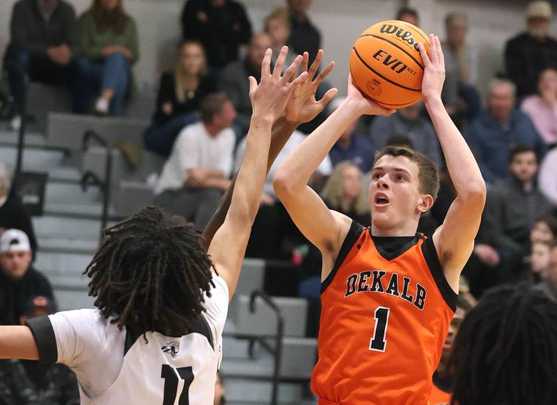 DeKalb's Jackson Kees shoots over Kaneland's Evan Frieders during their game Tuesday, Jan. 28, 2025, at Kaneland High School in Maple Park.