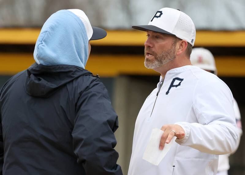 Parkview Christian Academy head coach Ryan Malkowski talks to one of his assistants Thursday, April 17, 2025, during their game at Hiawatha High School in Kirkland.