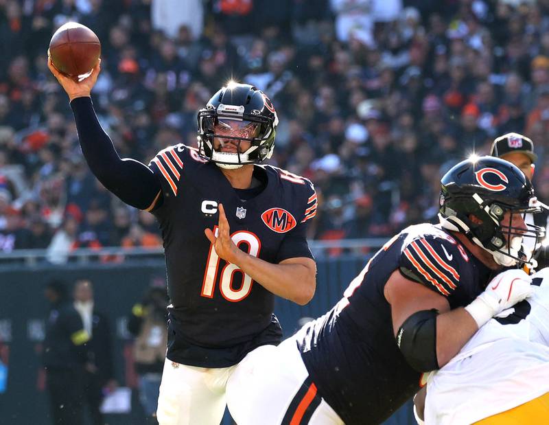 Chicago Bears quarterback Caleb Williams throws to tight end Colston Loveland for a touchdown Sunday, Nov. 23, 2025, at Soldier Field in Chicago.