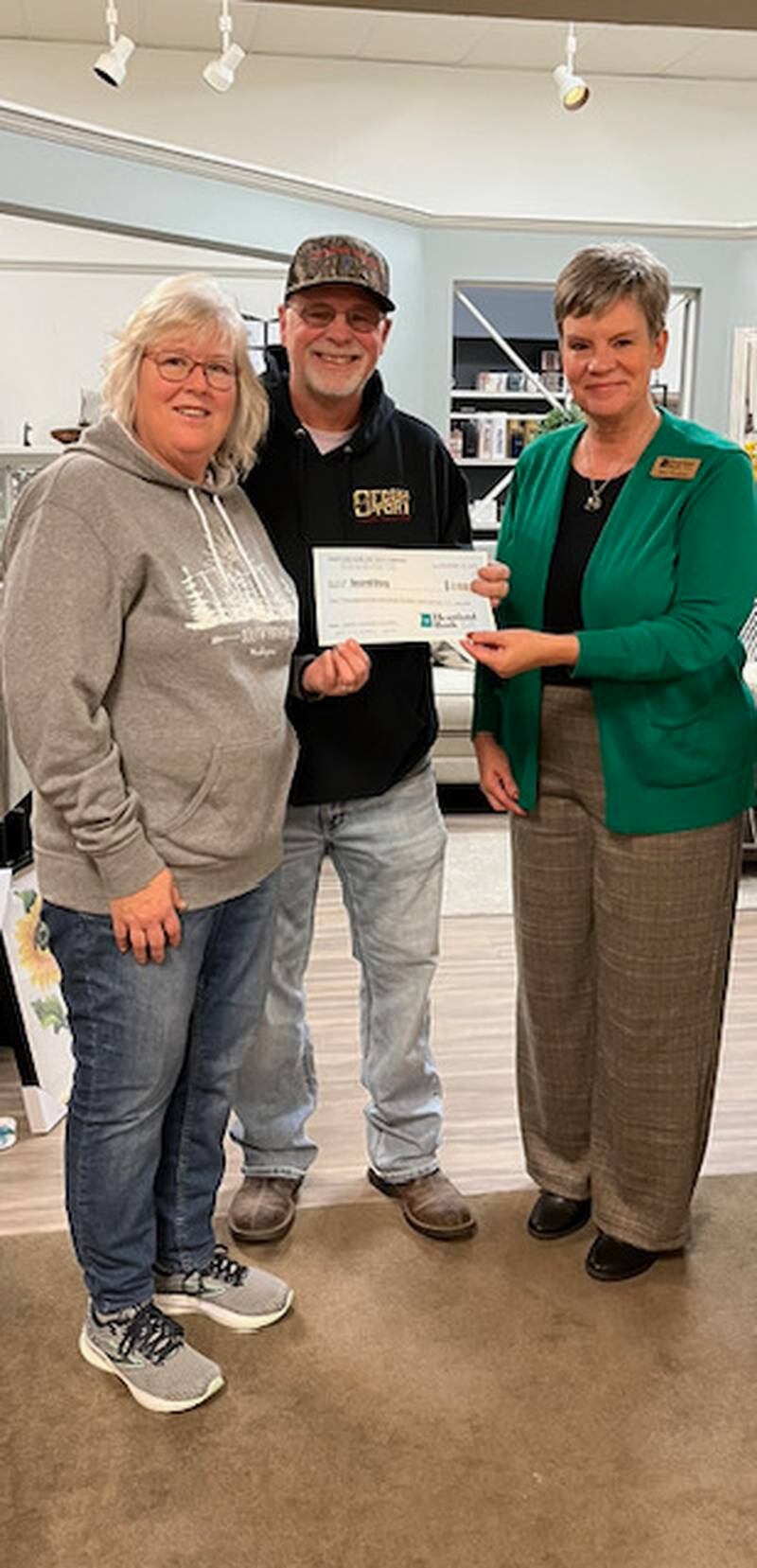 Midland States Bank’s Assistant Vice President and Retail Banking Manager, Sara Hudson, presented a donation of $2,500 to Jeff and Dana VanAutreve of Princeton’s Second Story Teen Center.