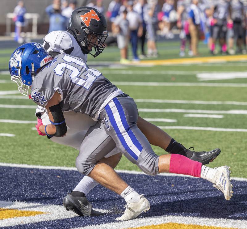 Newman’s Rylan Alvarado tackles Kewnee’s Chris Crowe in the end zone for a safety Saturday, Oct. 18, 2025.