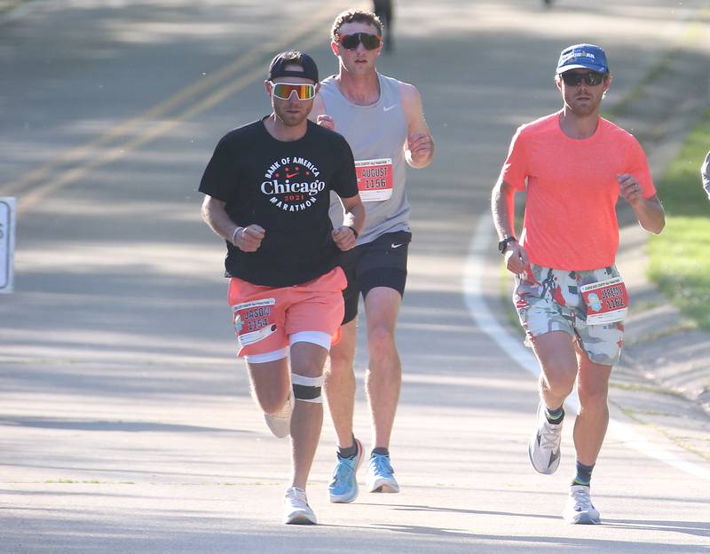 (From left) Jason Bauer, August Henson and Jeremy Bauer run in the Starved Rock Country half-marathon on Saturday, May 10, 2025 at Starved Rock State Park.