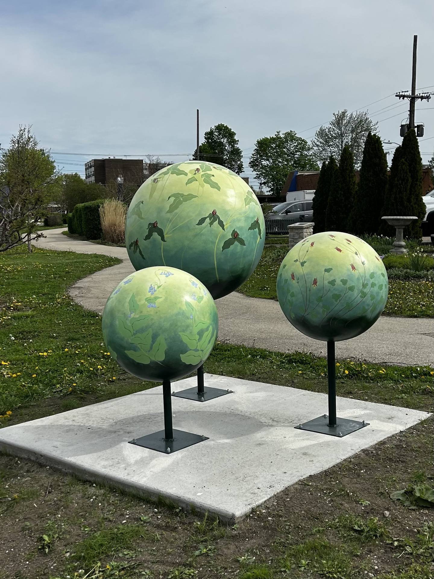 Clara Brubaker’s marbles depict native plants, installed on the Canal Street Sculpture Walk.
