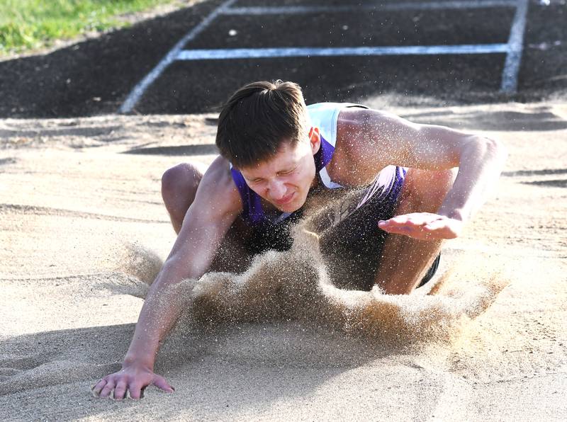 Dixon's Deaglan Taylor lands in the sand as he competes in the triple  jump at the Big Northern Conference Meet at Stillman Valley on Thursday, May 14, 2026.