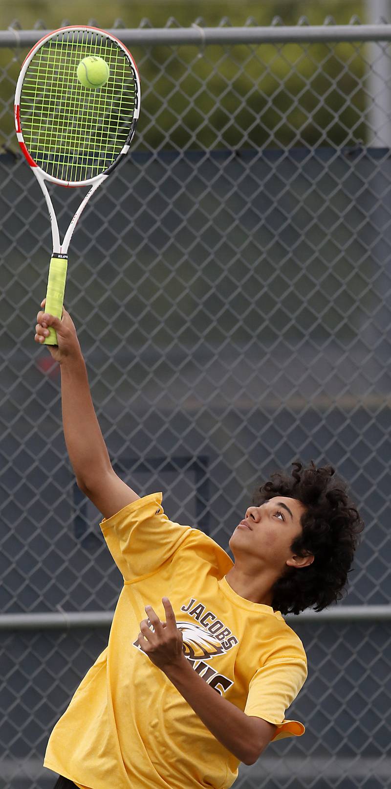 Jacobs’ Soham Kalra serves the ball during a IHSA 2A boys doubles tennis match Thursday, May 25, 2023, at Buffalo Grove High School.