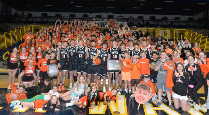 The Byroin Tigers pose with their student section after winning the 2A Supersectional in Sterling on Monday, March 4, 2024. The Tigers beat Chicago Latin 85-71 to advance to the state finals this week in Champaign. Byron will play Benton at 3:45 p.m. on Thursday in the semifinals. The 2A championship is scheduled for Saturday at 1 p.m.