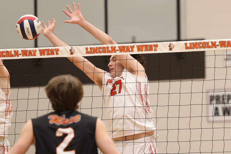 Plainfield East’s Timothy Bannon goes for the block against Lincoln-Way West on Wednesday, March 22nd. 2023 in New Lenox.