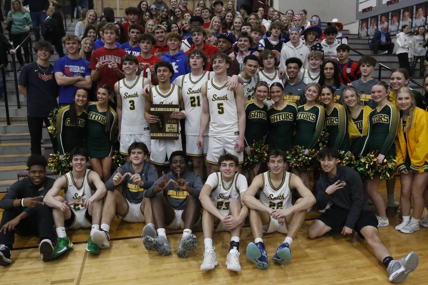 Crystal Lake South players pose with their fans after Crystal Lake South defeated Cary-Grove in the IHSA Class 3A Prairie Ridge Regional championship basketball game on Friday, Feb. 28, 2025, at Prairie Ridge High School in Crystal Lake.