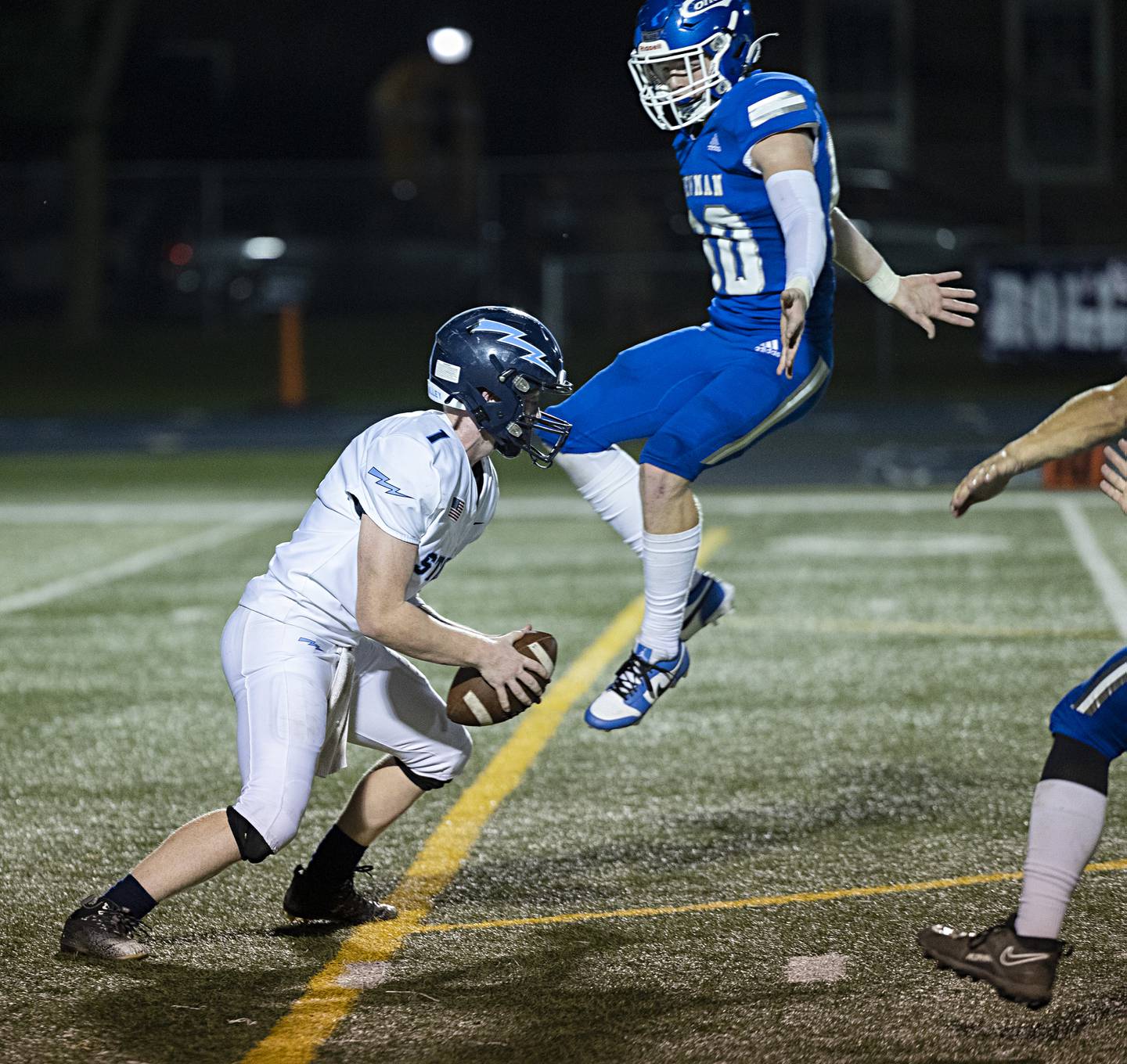 Newman’s Caleb Donna leaps against Bureau Valley’s Bryce Helm Friday, Sept. 29, 2023 in Sterling.