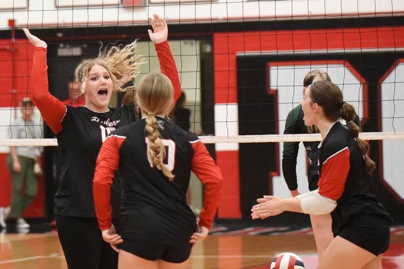 Bradley-Bourbonnais' Elena Shold, left, celebrates a point with Boilermaker teammates Harper Tollefson (10) and Ella Haas during their 2-0 home All-City win over Bishop McNamara Wednesday, Sept. 10, 2025.