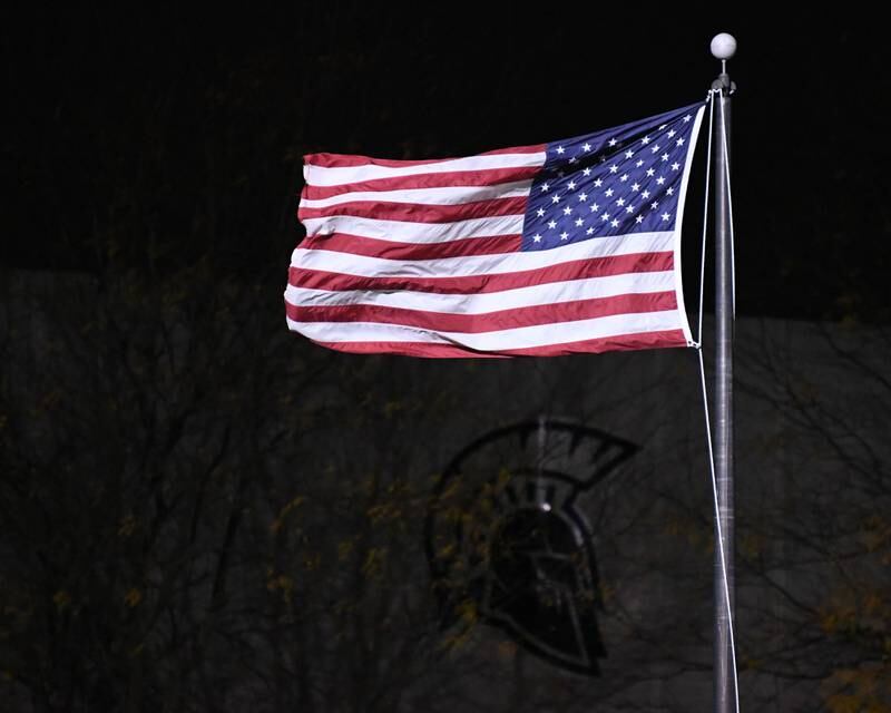 The American flag fly’s in the wind before the start of the Sycamore game on Friday Oct. 27, 2023, during the first week of play offs as they take on Evergreen Park in Sycamore.