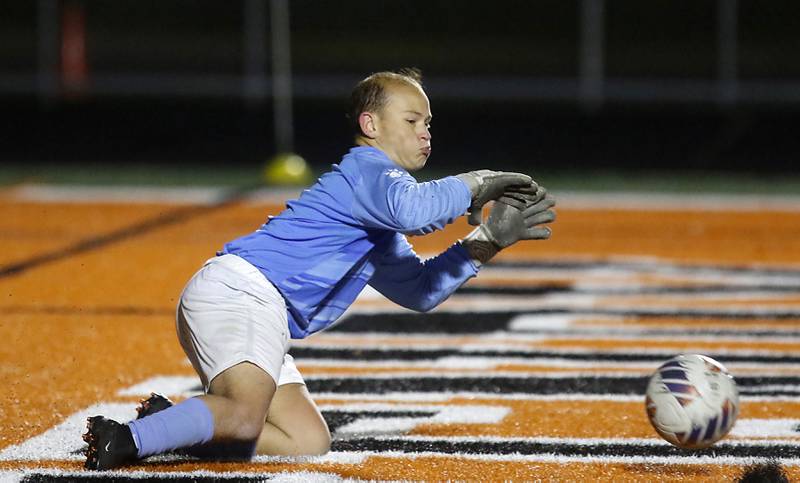 McHenry's Mason Bertone makes a save during a Fox Valley Conference soccer match against Prairie Ridge on Tuesday, Oct. 15, 2024, at McCraken Field in McHenry.