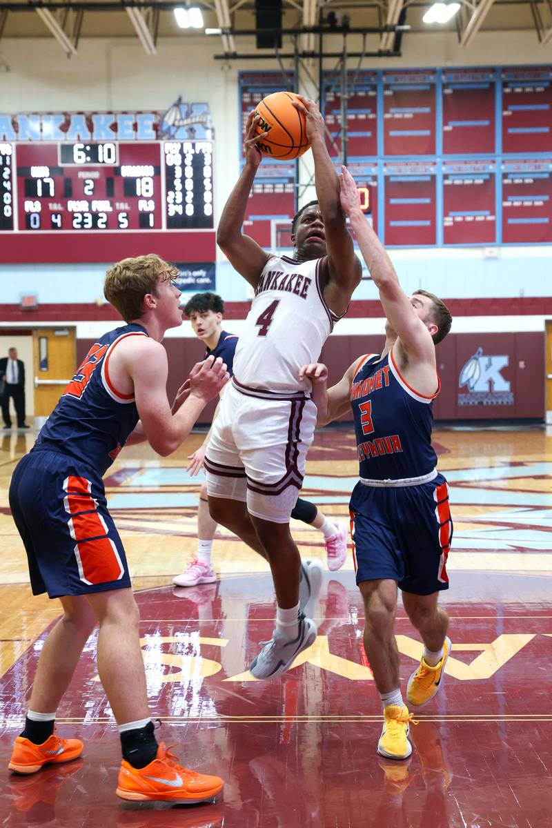 Kankakee's Myair Thompson maneuvers to the basket under pressure during the Kays' 74-60 victory over Mahomet-Seymour on Tuesday, Dec. 2, 2025.