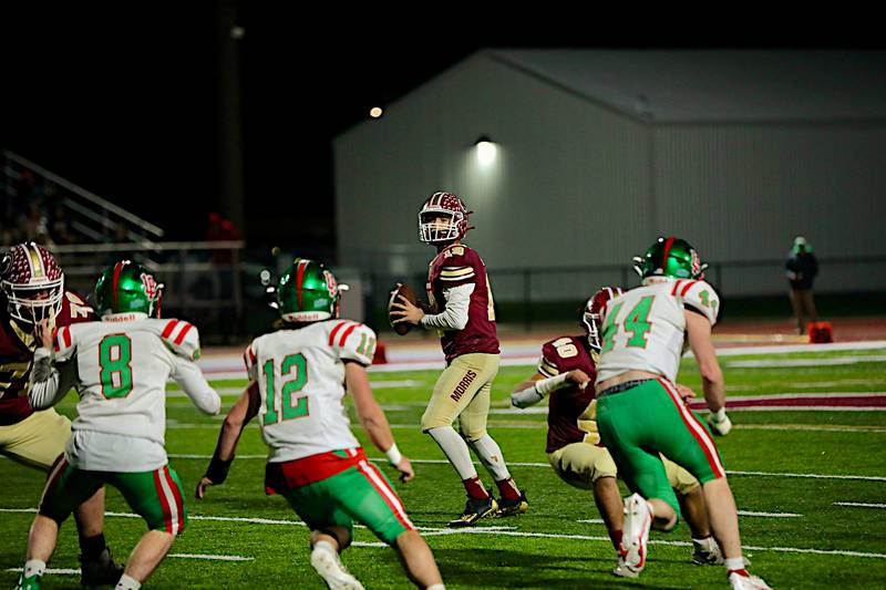 Morris' Zach Romak looks for a receiver Friday night in a 42-0 win over LaSalle-Peru in the first round of the Class 5A playoffs. Romak was 13 of 19 for 227 yards and four touchdowns and also ran 15 times for 73 yards.