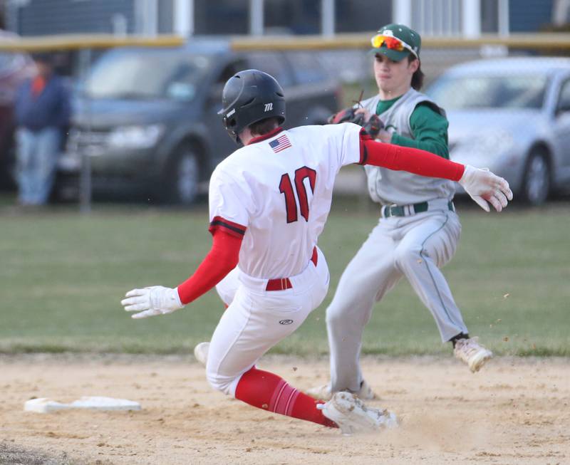 Hall's Evan Stefanick slides safely into second base as St. Bede's John Brady waits for the late throw on Monday, March 27, 2023 at Kirby Park in Spring Valley.