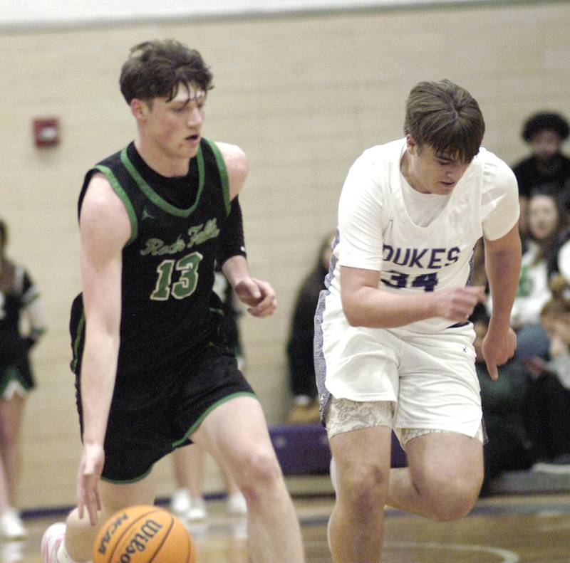 RF player Ryken Howard gets the ball past Dixon's Jakob Nicklaus. Dixon hosted Rock Falls in boys basketball Friday, February 14, 2025 at Lancaster Gym at Dixon High School. Rock Falls won a hard fought game 48-46.