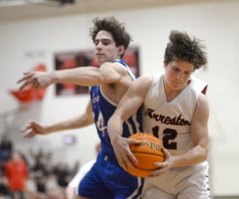 Forreston's Darin Greenfield (12) snags a rebound against Oregon during a Saturday, Jan. 25, 2025 game at Forreston High School.