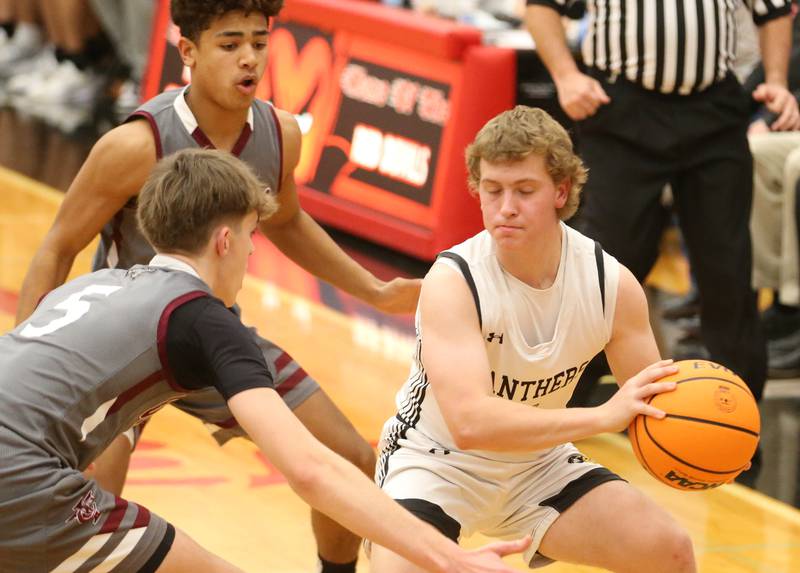 Putnam County's Drew Carlson is stuck in the corner with Illinois Valley Central defenders Grady Read and Brynden Coventry during the 50th annual Colmone Classic on Thursday, Dec. 12, 2024 at Hall High School.