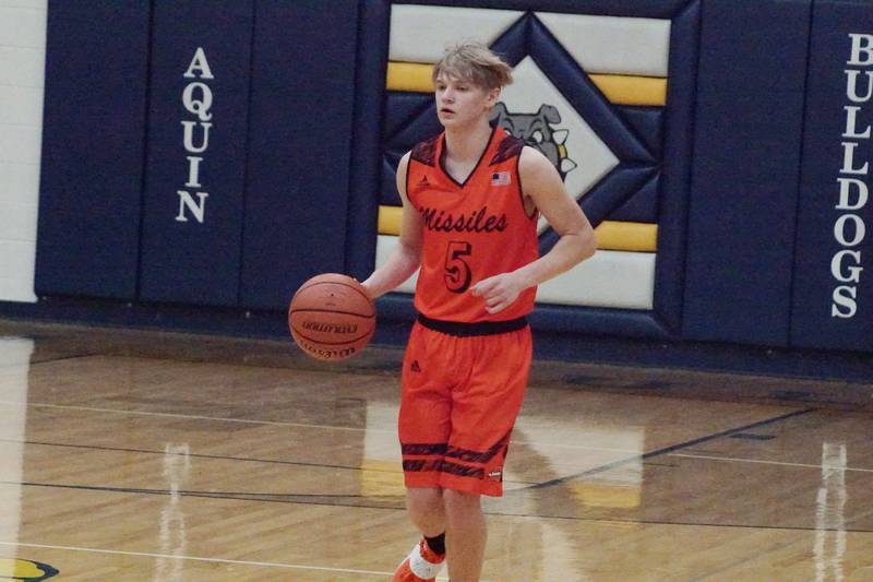 Bryce Aude of Milledgeville handles the ball Saturday, Feb. 20, 2022 against Aquin in the Regional quarterfinal. Aquin won 68-58.