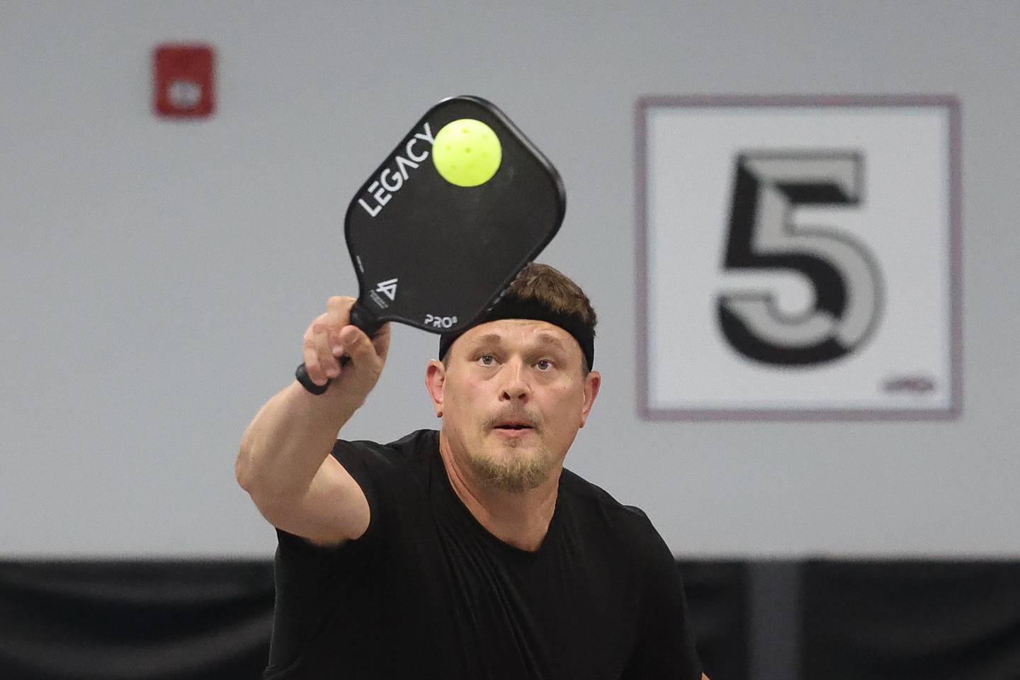 Adam Nurczvk returns the ball in a pickleball league match at GameChangers on Tuesday, May 28, 2024 in Shorewood.