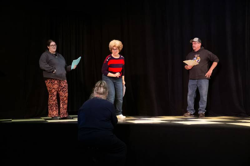 Director Margo Ackland working on a scene from the upcoming Performing Arts Guild presentation "A Winter Medley" with actors Brianna Fuentes, Connie Augsburger and Morgan McConnell.