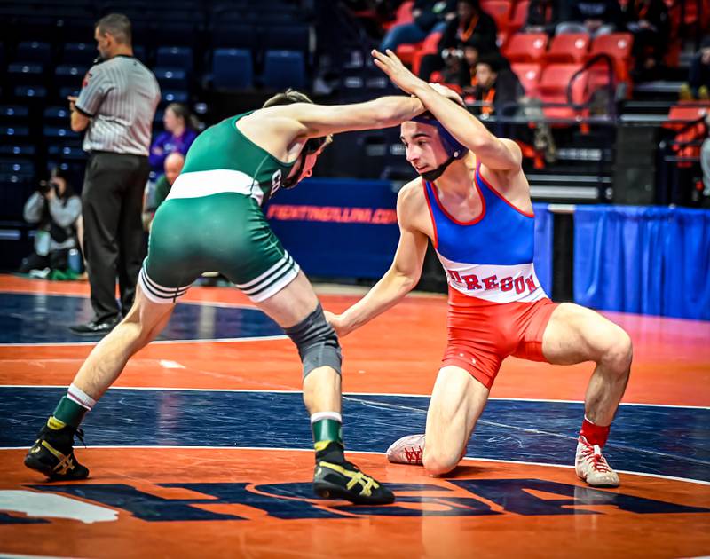 Oregon's Josiah Perez (right) finished in sixth place at 113 pounds at the 1A state wrestling meet in Champaign on Saturday, Feb. 22, 2025.