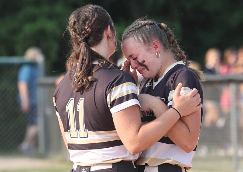 Sycamore's Brooklynn Snodgrass (left) and Brighton Snodgrass console each other after their loss in the Class 3A supersectional game to Antioch Monday, June 5, 2023, at Kaneland High School in Maple Park.