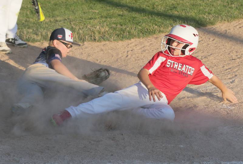 Peru All-Stars pitcher Alex Lamps misses the tag on Streator's Zerek Sibert at the plate in the 10-Year-Old District 20 Little League championship game on Wednesday, July 13, 2022, at Jim Bottomley Field in Oglesby.