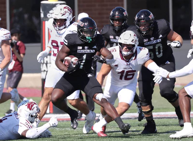 Northern Illinois’ Antario Brown breaks through the Southern Illinois defensive line during their game Saturday, Sept. 9, 2023, in Huskie Stadium at NIU in DeKalb.