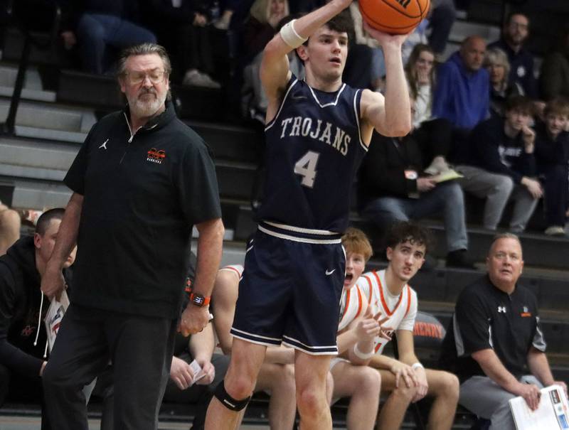 McHenry’s Head Coach Corky Card watches as Cary-Grove’s Dylan Dumele takes an outside shot in varsity boys basketball on Tuesday, Feb. 17, 2026, at McHenry High School in McHenry.
