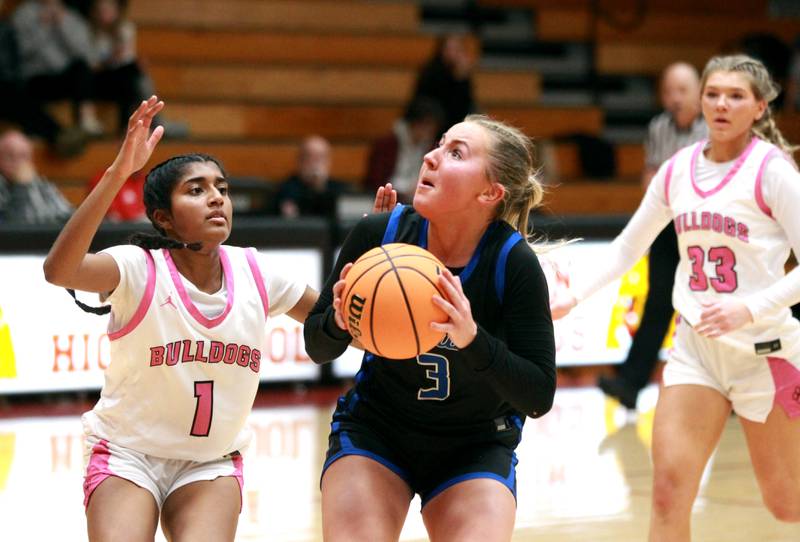 St. Charles North’s Brianna Buono looks for a shot from under the basket during a game against Batavia on Monday, Dec. 16, 2024 in Batavia.