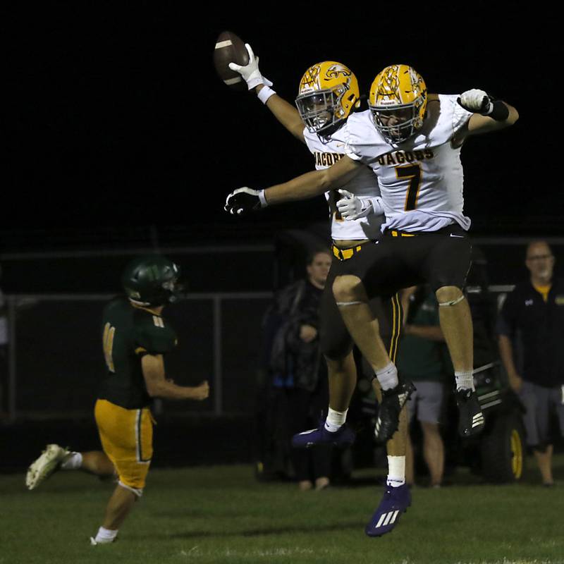 Jacobs’ Nick True, right, and his teammate,  Grant Stec, left, celebrate a touchdown during a Fox Valley Conference football game Friday, Aug. 26, 2022, between Crystal Lake South and Jacobs at Crystal Lake South High School.