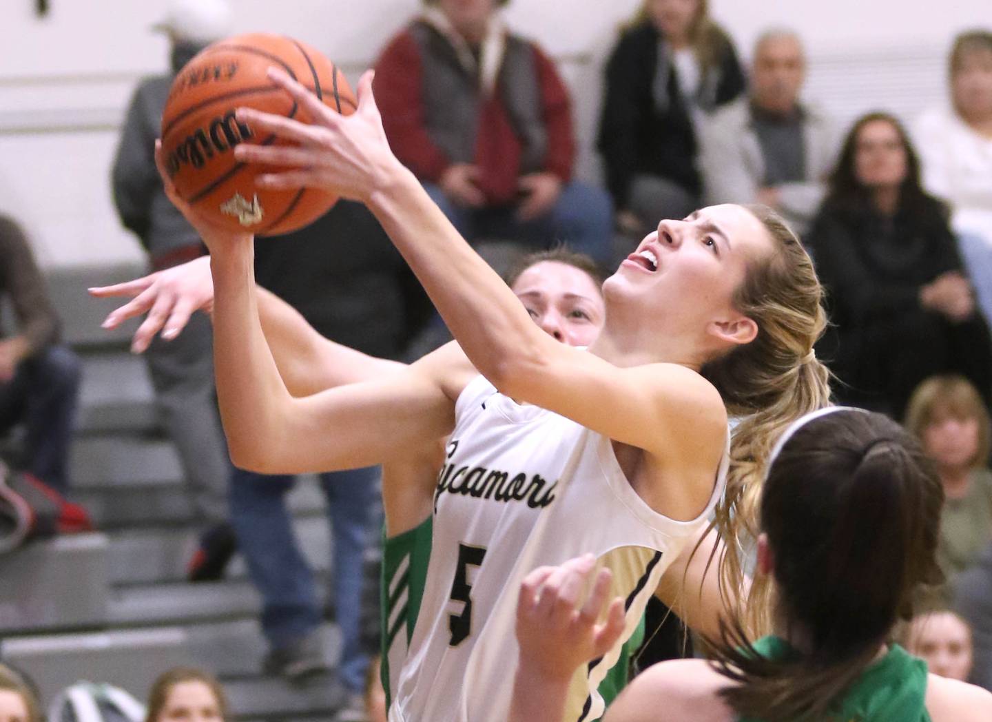 Sycamore's Faith Feuerbach shoots over Providence Catholic's Kelly Knight during their game Tuesday, Feb. 22, 2022, in the Class 3A Kaneland sectional in Maple Park.