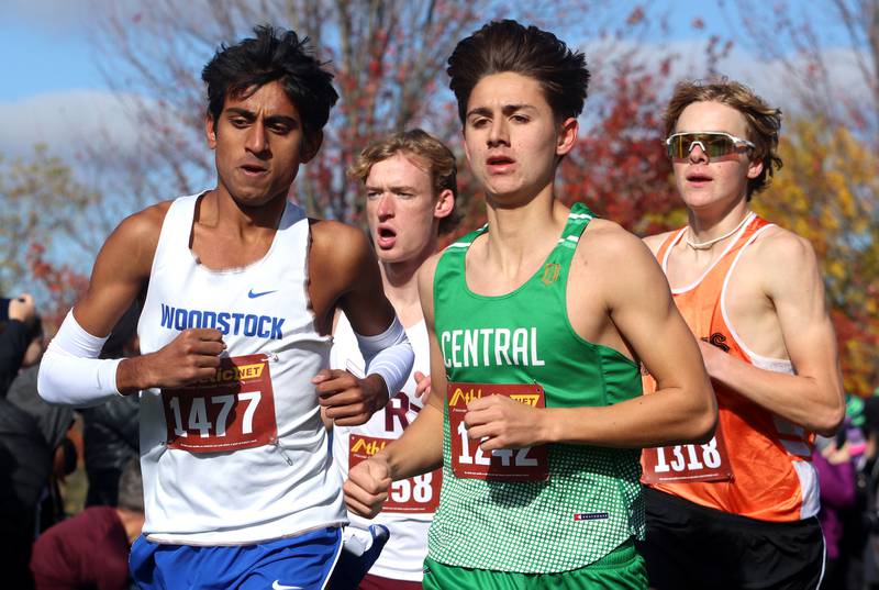 Woodstock’s Ishan Patel, left, battles Grayslake Central’s Trey Sato during a boys Class 2A Sectional Cross Country Meet at Emricson Park in Woodstock Saturday.