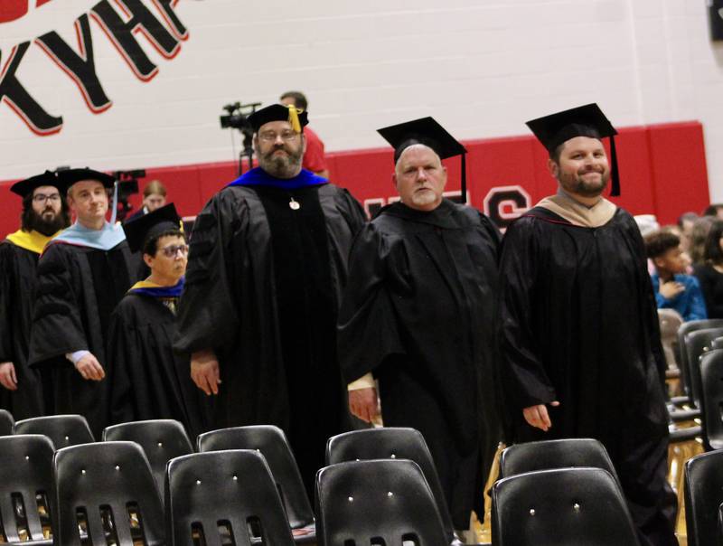 Members of the Sauk Valley Community College faculty file into the main gym during the processional portion of commencement on Friday, May 12, 2023.