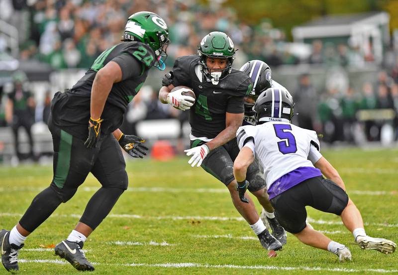 Glenbard West’s Jamarcus Kelly tries to sidestep Downers Grove North defender Maxwell Troha (5) during a Class 7A second-round playoff game on November 8, 2025 at Glenbard West High School in Glen Ellyn.