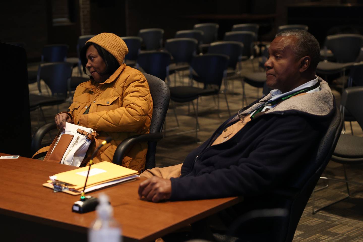 Jeanetta Gordon, left, and City Council candidate Michael Carruthers wait for city council members to return at a hearing on the validity of his nominating petitions at the Joliet City Electoral Board meeting on January 4th.