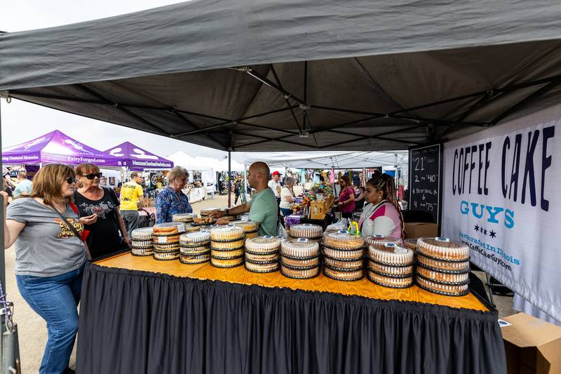 The Coffee Cake Guys booth offers sweet treats at the artisan market during Old Canal Days in Lockport on June, 7, 2025.