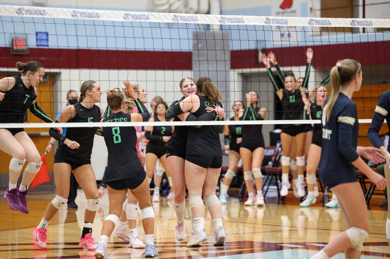 Providence's Abbey Knight hugs teammate Grace Lustig as the team celebrates a point during the Celtics' victory in two sets, 25-25, 25-18, over Lemont in the IHSA Class 3A Kankakee Sectional championship on Thursday, Nov. 6, 2025.