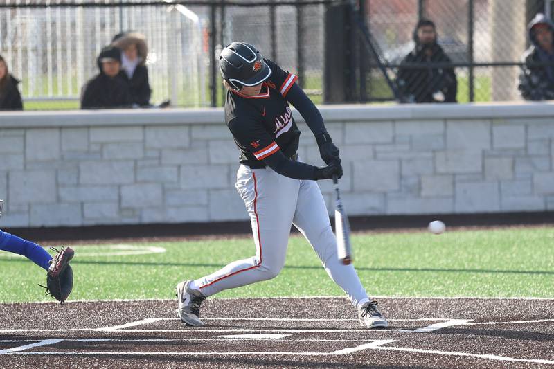 Minooka’s Rhett Harris connects for a RBI single against Joliet Central on Monday, April 6, 2026 in Joliet.