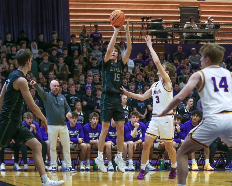 Glenbard West's Drew Gacek (15) shoots a jumper during their basketball game between Glenbard West at Downers Grove North. Jan 24, 2025 in Downers Grove.