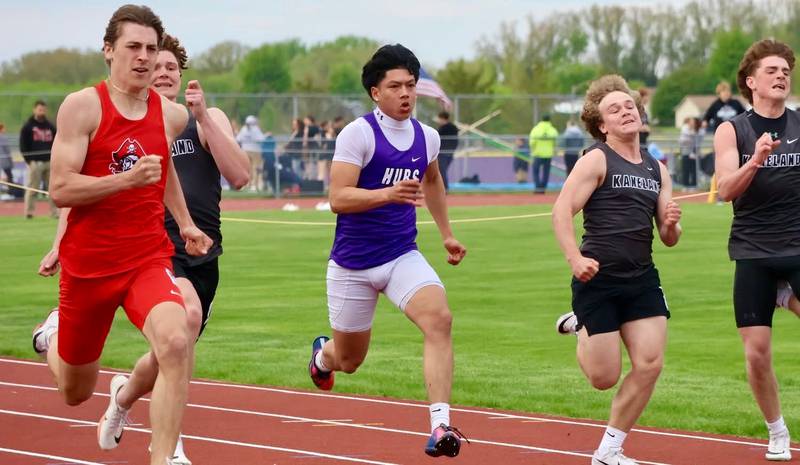 Rochelle's German Albertson (in purple) runs in the 100-meter dash during a meet held April 28 in Rochelle.