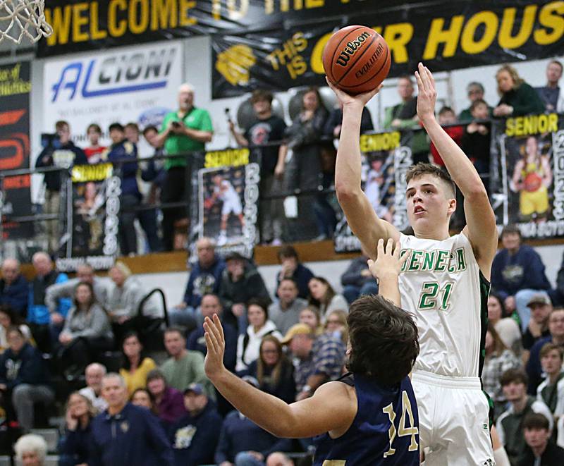 Seneca's Lane Provance shoots a jump shot over Marquette's Alex Graham during the Tri-County Conference championship game on Friday, Jan. 27, 2023 at Putnam County High School.